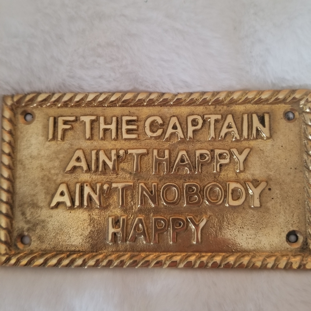 If the Captain Ain't  Happy brass sign.